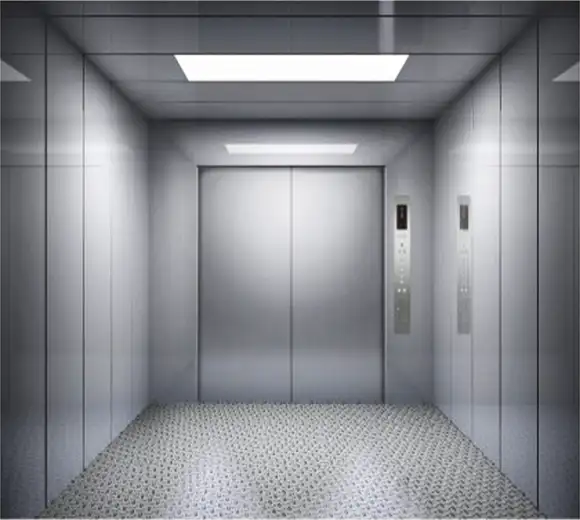 Freight elevator with a ceiling light, designed for transporting goods and cargo efficiently