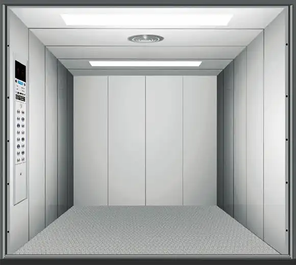 Interior view of a cargo lift featuring a control button and a light indicator for operation.
