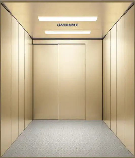 An empty car elevator featuring a white floor and elegant gold walls.